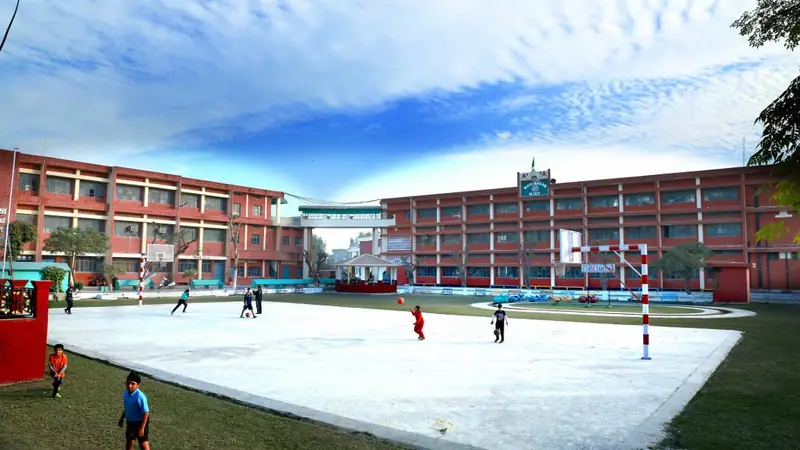 The school building and lawns seen from the grounds