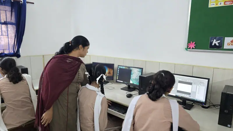 Students working at computers in the school computer lab
