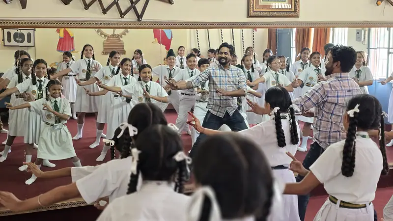 Students practising a dance routine in the dance room