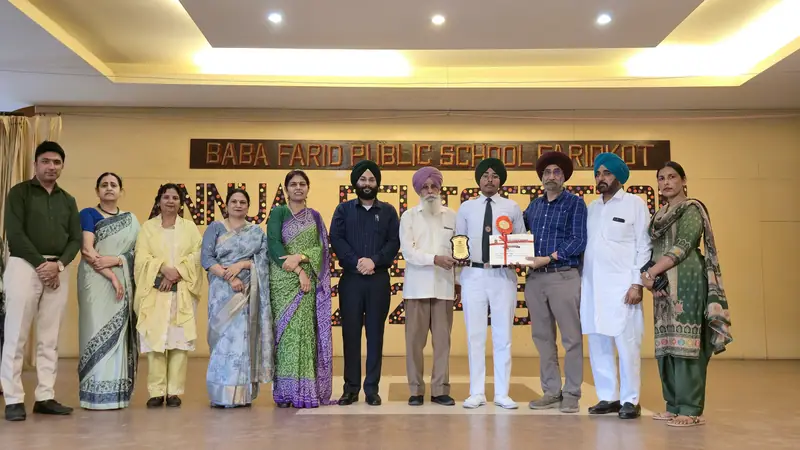 Guests and staff on the stage of the Farid Auditorium