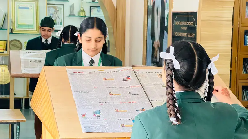 Students choosing books in the library