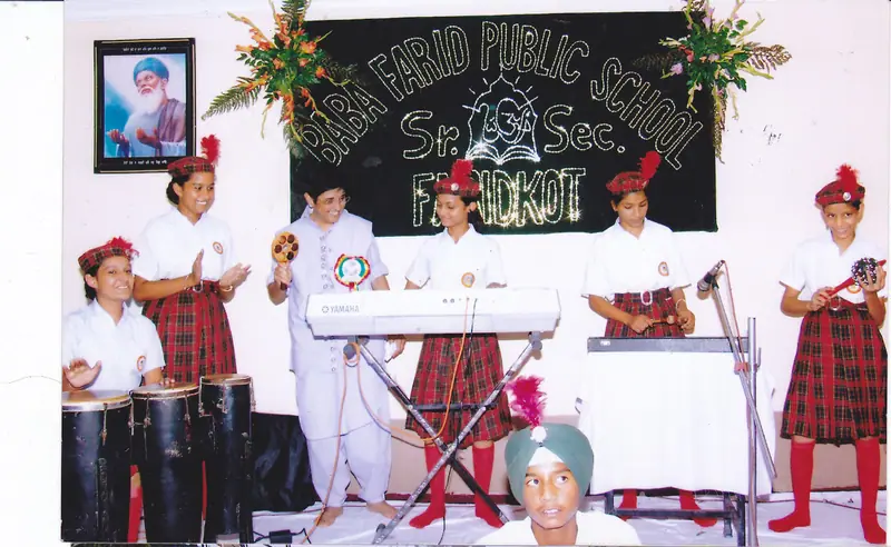 Students performing music on stage