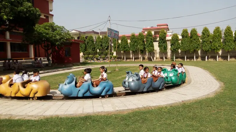 Young children enjoying a ride on the Farid Express toy train