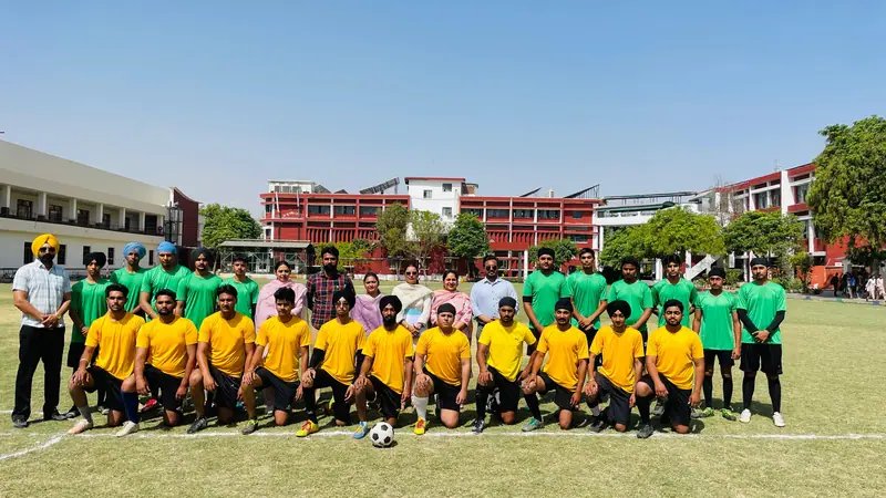Students in sports kit lined up on the school sports ground