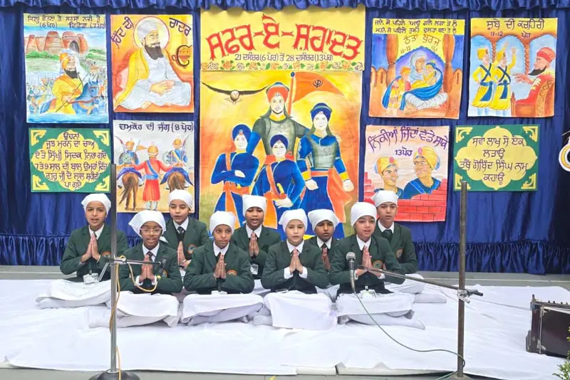 Students presenting a cultural performance on stage