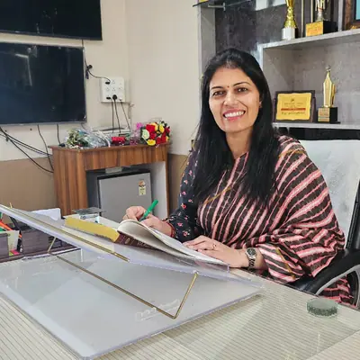 Ms. Sukhdeep Kaur, Principal, seated at her desk